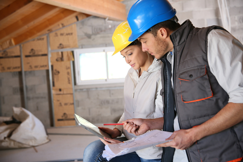 Young woman in professional training on building site